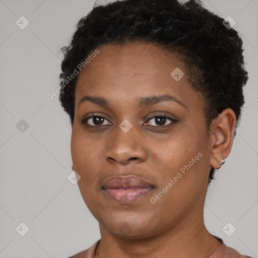 Joyful black young-adult female with short  black hair and brown eyes