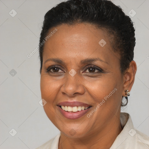 Joyful black adult female with short  brown hair and brown eyes