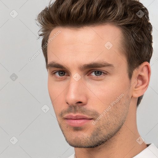 Neutral white young-adult male with short  brown hair and brown eyes