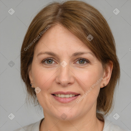 Joyful white adult female with medium  brown hair and grey eyes