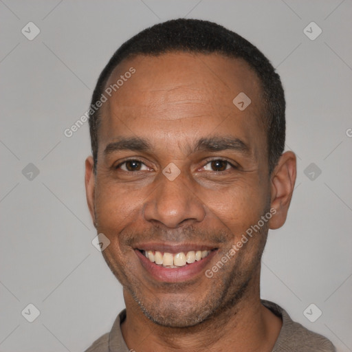 Joyful latino adult male with short  black hair and brown eyes