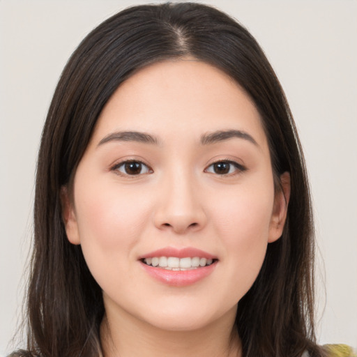 Joyful white young-adult female with long  brown hair and brown eyes