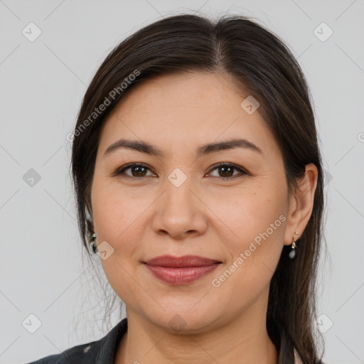 Joyful white adult female with medium  brown hair and brown eyes