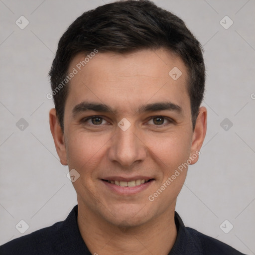 Joyful white young-adult male with short  black hair and brown eyes