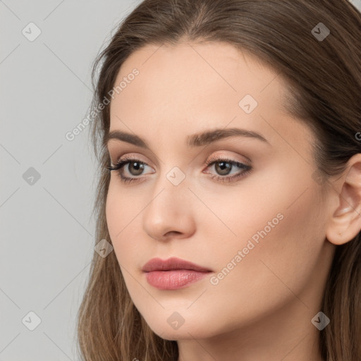 Neutral white young-adult female with long  brown hair and brown eyes