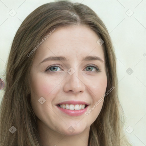 Joyful white young-adult female with long  brown hair and blue eyes