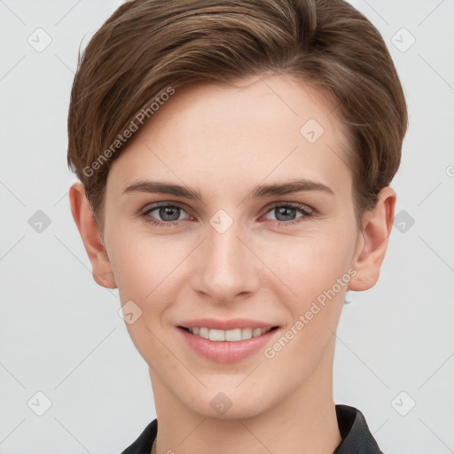 Joyful white young-adult female with short  brown hair and grey eyes