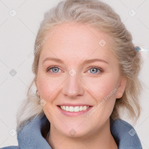 Joyful white young-adult female with medium  brown hair and blue eyes