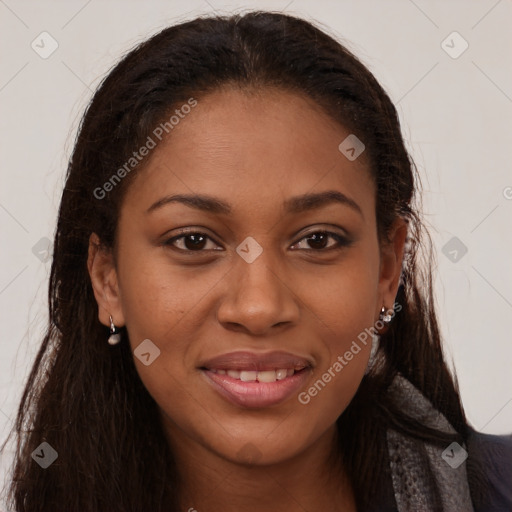 Joyful black young-adult female with long  brown hair and brown eyes