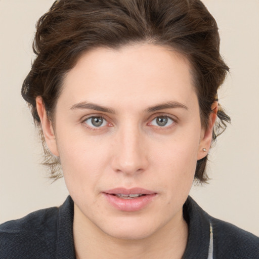 Neutral white young-adult female with short  brown hair and brown eyes