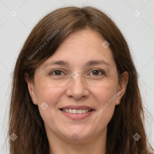 Joyful white adult female with long  brown hair and grey eyes