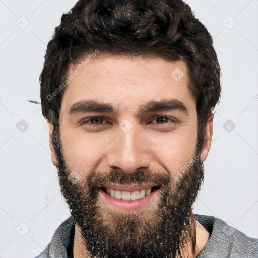 Joyful white young-adult male with short  black hair and brown eyes