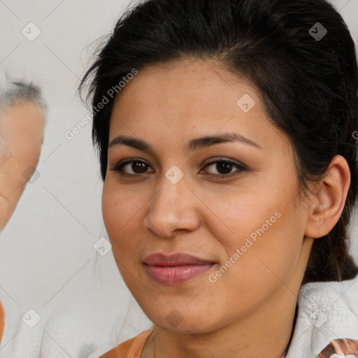 Joyful latino young-adult female with medium  brown hair and brown eyes