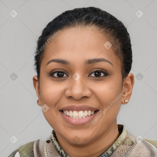 Joyful latino young-adult female with short  black hair and brown eyes