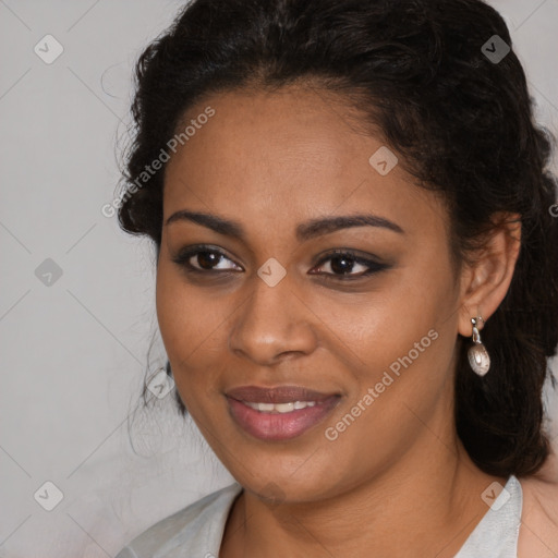 Joyful black young-adult female with long  brown hair and brown eyes