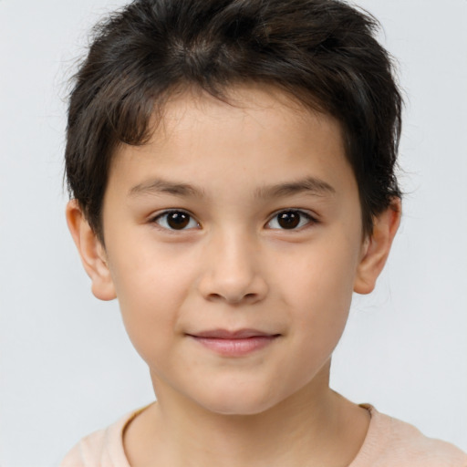 Joyful white child male with short  brown hair and brown eyes