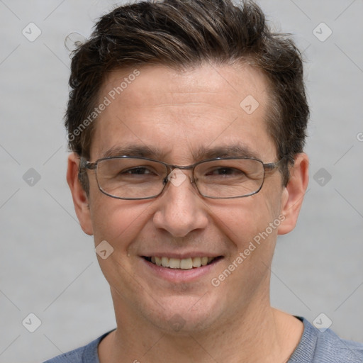 Joyful white adult male with short  brown hair and grey eyes