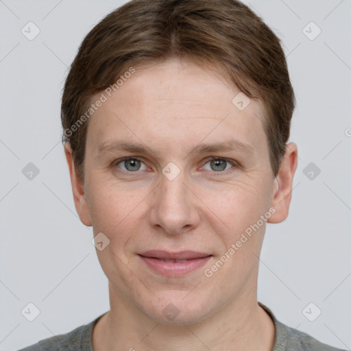 Joyful white adult male with short  brown hair and grey eyes