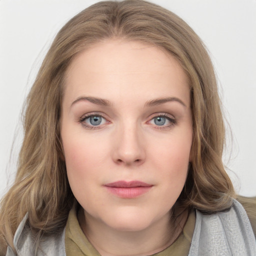 Joyful white young-adult female with medium  brown hair and blue eyes