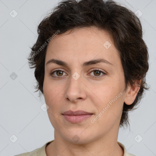 Joyful white adult female with short  brown hair and brown eyes