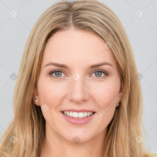 Joyful white young-adult female with long  brown hair and green eyes