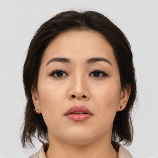 Neutral asian young-adult female with medium  brown hair and brown eyes