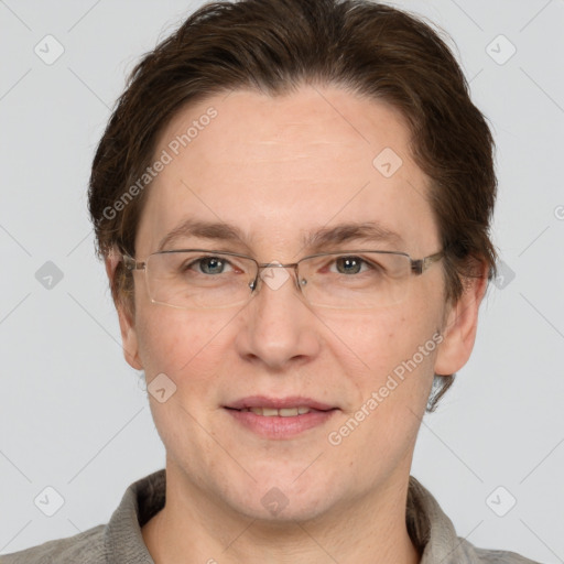 Joyful white adult male with short  brown hair and grey eyes