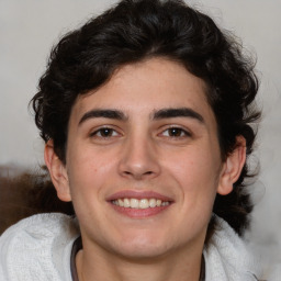 Joyful white young-adult male with medium  brown hair and brown eyes