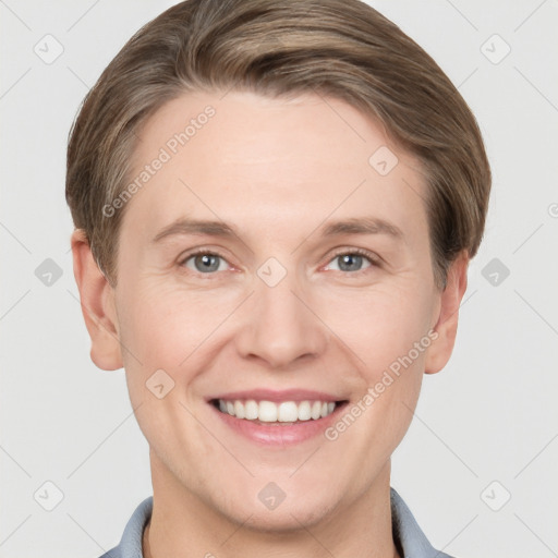 Joyful white young-adult female with short  brown hair and grey eyes