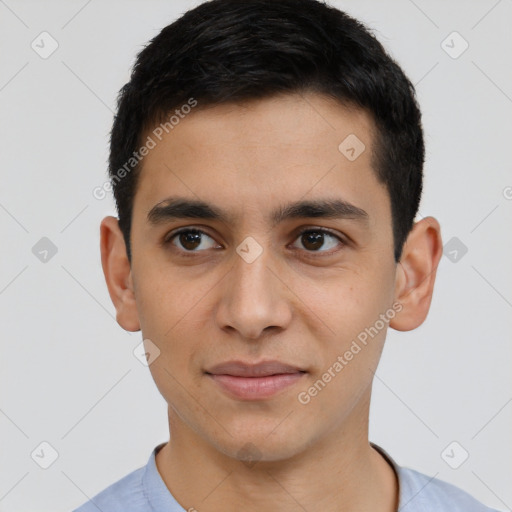 Joyful latino young-adult male with short  black hair and brown eyes