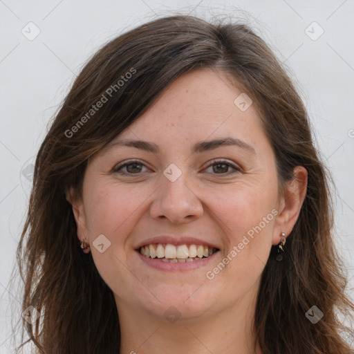 Joyful white young-adult female with long  brown hair and grey eyes