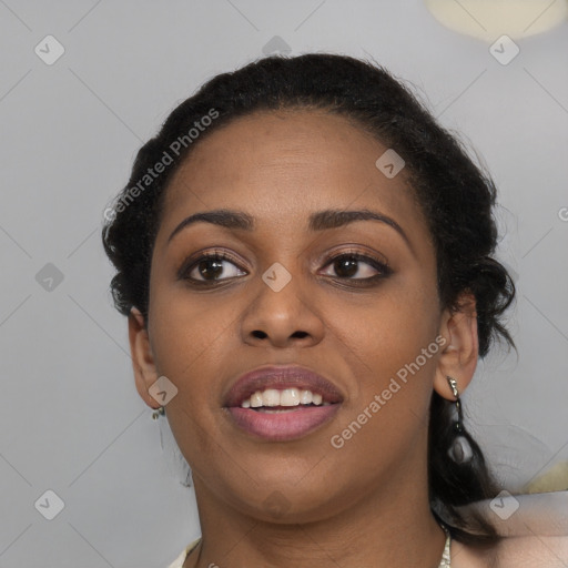 Joyful black young-adult female with medium  brown hair and brown eyes