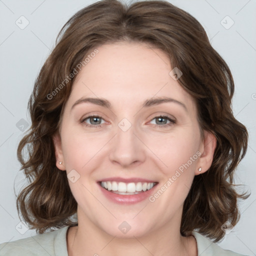 Joyful white young-adult female with medium  brown hair and blue eyes