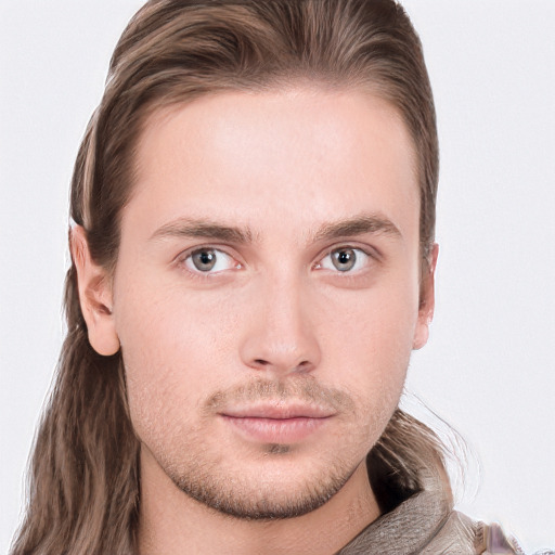 Neutral white young-adult male with long  brown hair and blue eyes