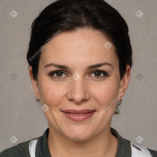 Joyful white adult female with medium  brown hair and brown eyes