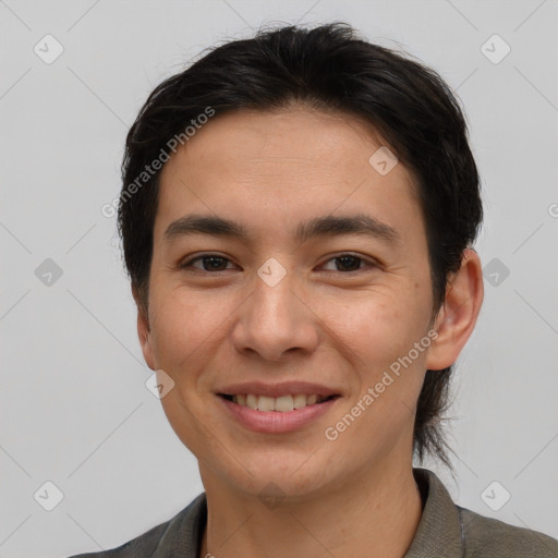 Joyful asian young-adult male with short  brown hair and brown eyes