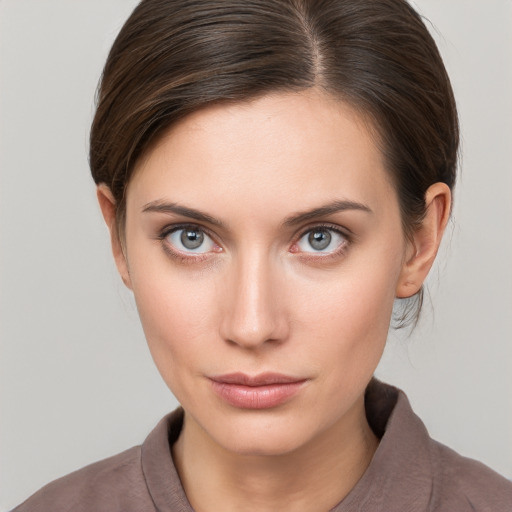 Neutral white young-adult female with medium  brown hair and grey eyes