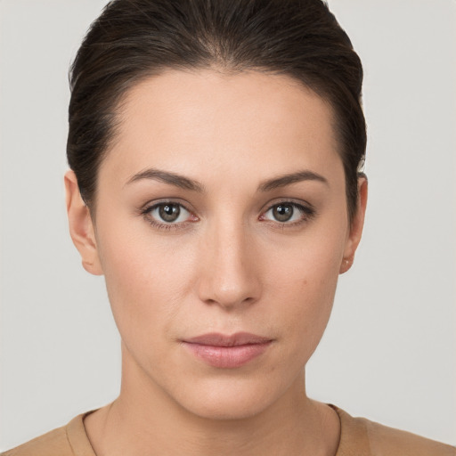 Neutral white young-adult female with short  brown hair and brown eyes