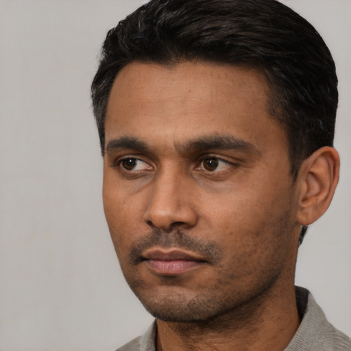 Neutral latino young-adult male with short  black hair and brown eyes
