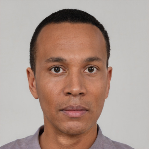 Neutral black adult male with short  black hair and brown eyes