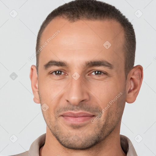 Joyful white adult male with short  brown hair and brown eyes