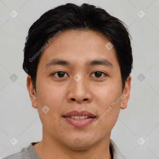 Joyful asian young-adult male with short  brown hair and brown eyes