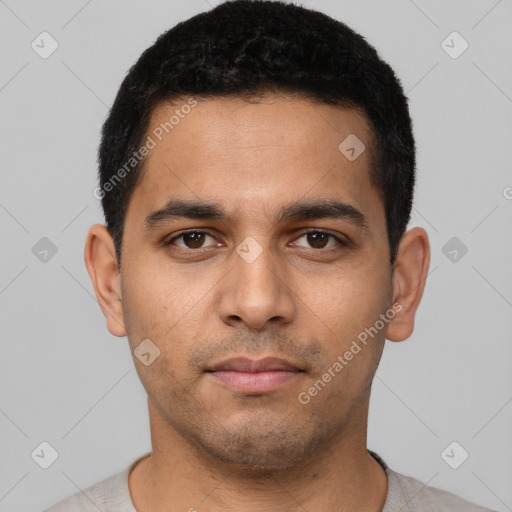 Neutral latino young-adult male with short  black hair and brown eyes