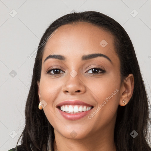 Joyful white young-adult female with long  black hair and brown eyes