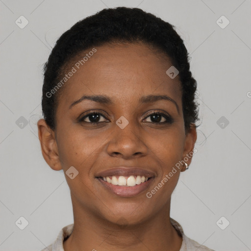 Joyful black young-adult female with short  brown hair and brown eyes