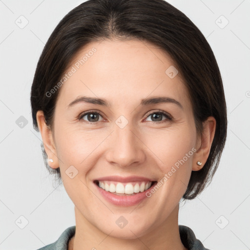 Joyful white young-adult female with medium  brown hair and brown eyes