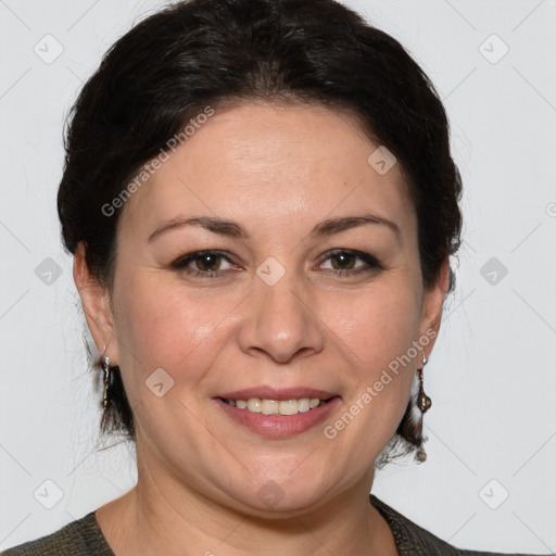 Joyful white adult female with medium  brown hair and grey eyes