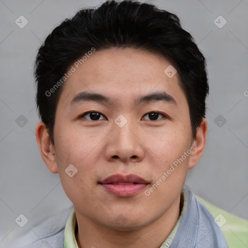 Joyful asian young-adult male with short  black hair and brown eyes