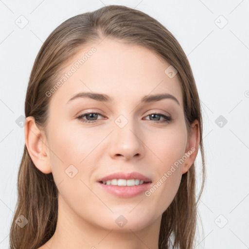 Joyful white young-adult female with long  brown hair and grey eyes