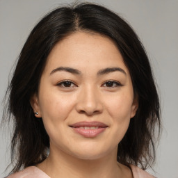 Joyful asian young-adult female with medium  brown hair and brown eyes